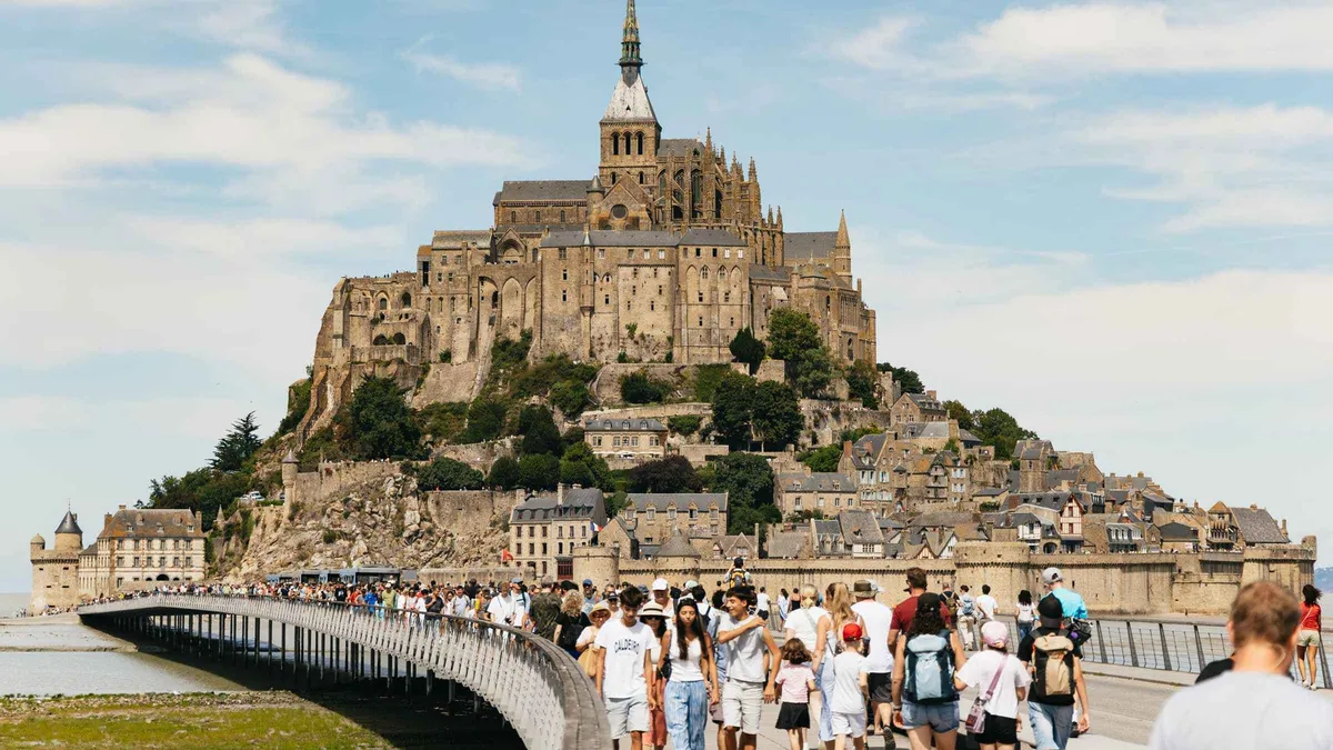 Mont-Saint-Michel abbey above the tidal flats on a day tour from Paris to Mont-Saint-Michel, France