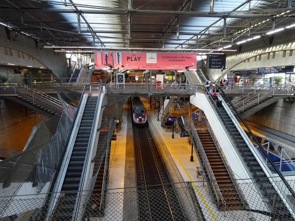 Platforms and escalators at Marne-la-Vallée-Chessy station, the stop for a day trip from Paris to Disneyland by train
