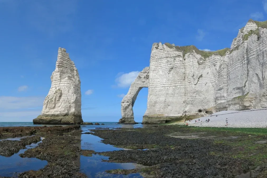 Chalk arch and needle of the Étretat cliffs in Normandy on a three-day trip from Paris