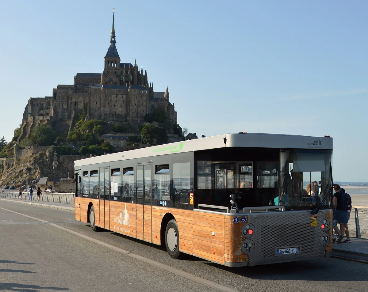Le Passeur shuttle bus on the causeway in front of Mont-Saint-Michel on a day trip from Paris
