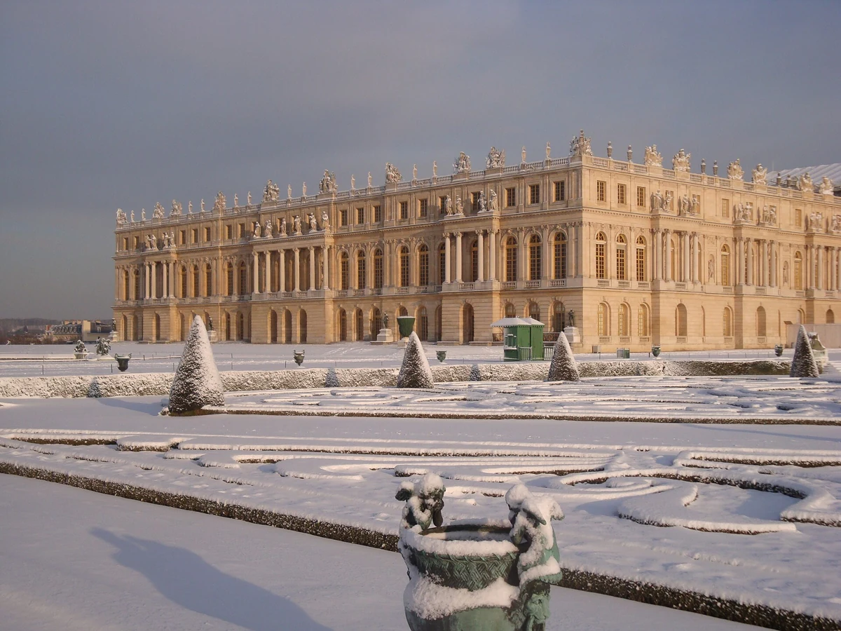 Palace of Versailles under snow on a winter day trip from Paris